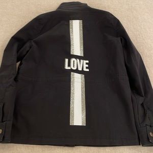Romi Basha cotton black jacket with Love on the back.